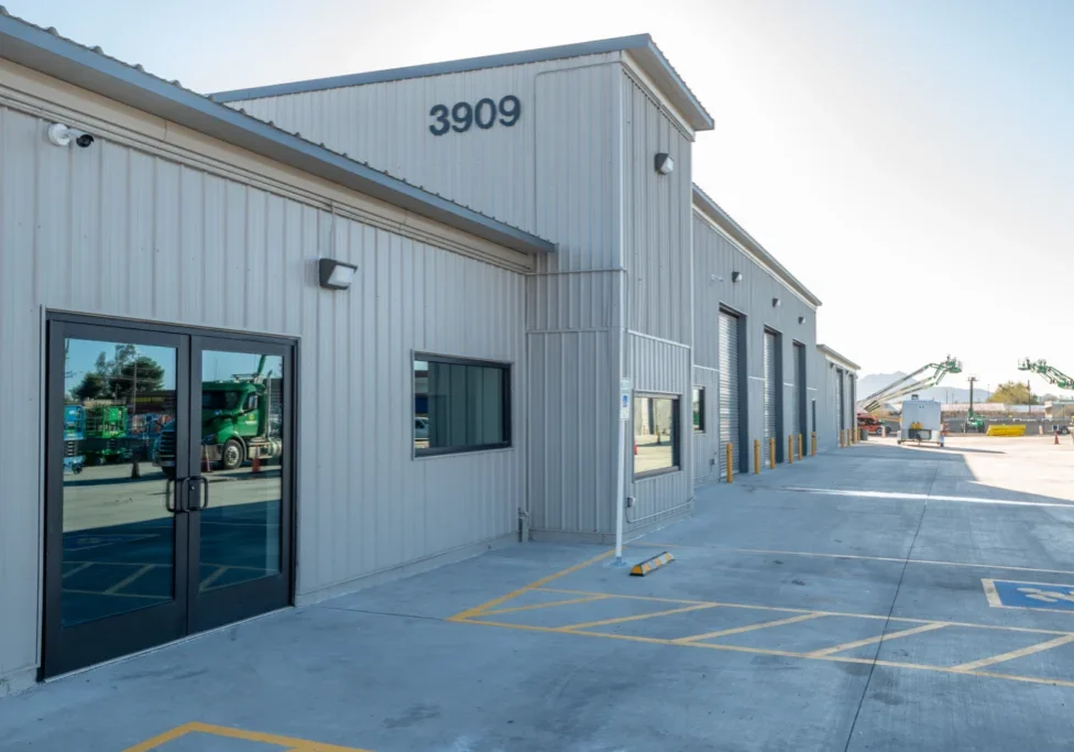 A large building with two doors and windows.